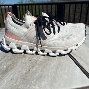 On Running Women's Athletic Shoes in White and Pink with Black Laces